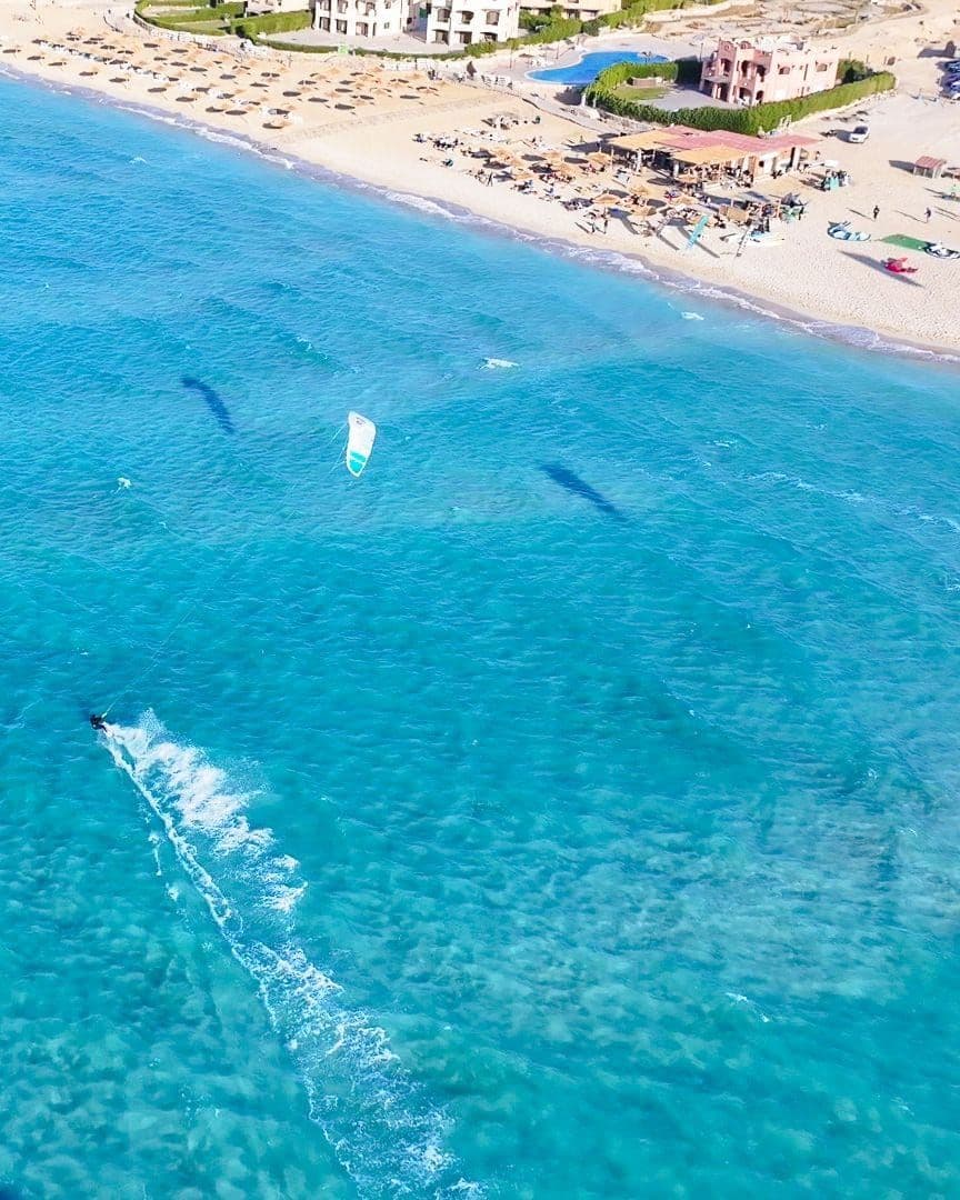 Aerial view of a kitesurfer on the lagoon beside the Soul beachfront.